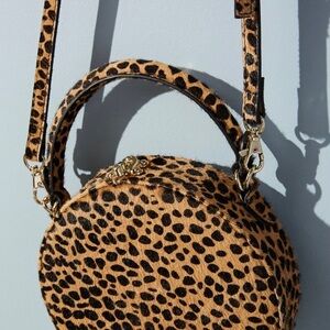 Circular leopard pony hair leather bag crossbody bag anthropology